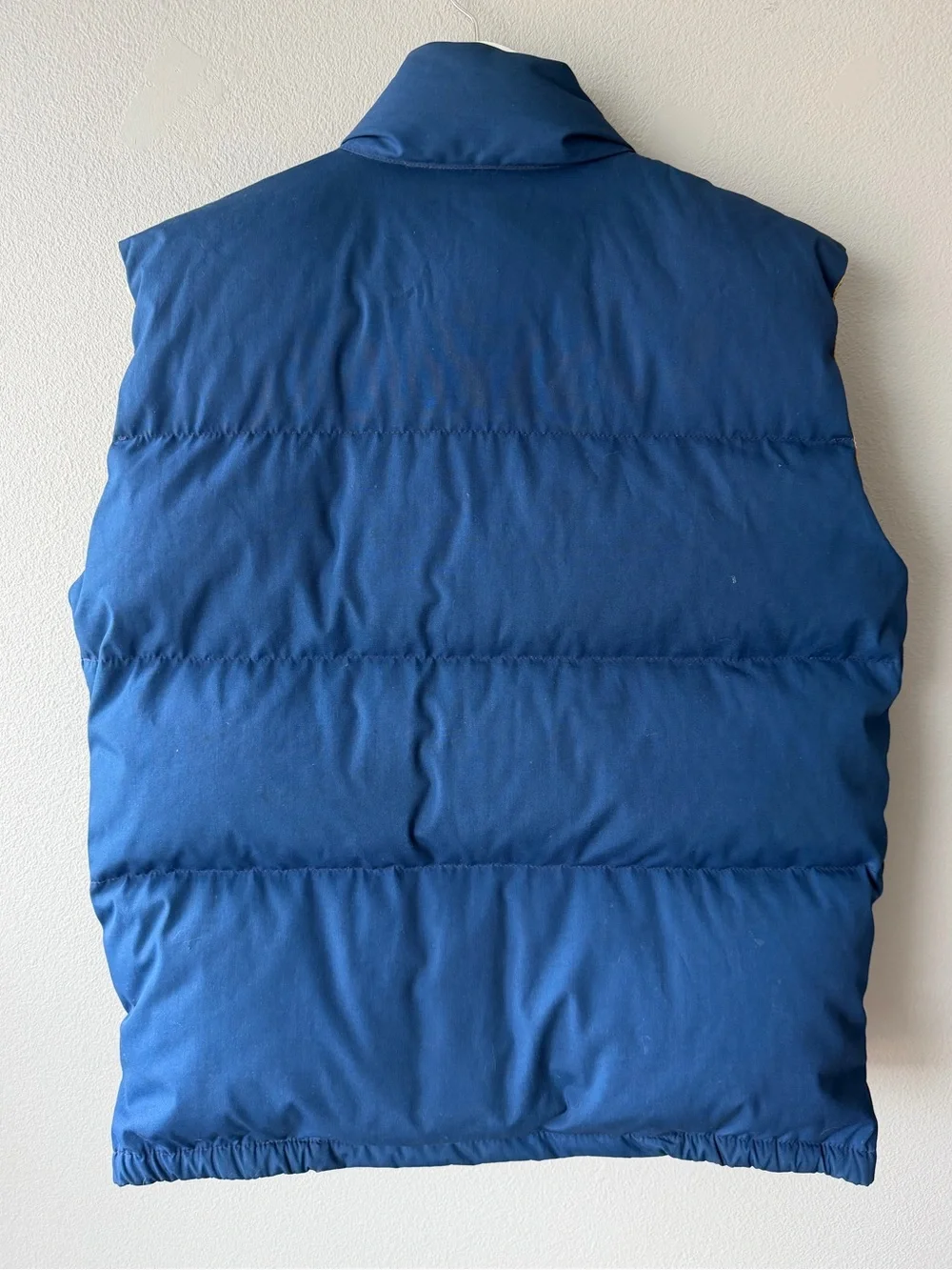 The North Face vintage blue goose down fill snap up puffer vest Men’s sz L